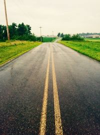 Surface level of empty road against sky