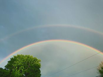 Low angle view of rainbow against sky