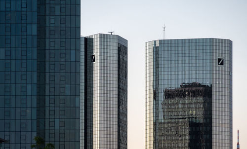 Low angle view of modern buildings against clear sky