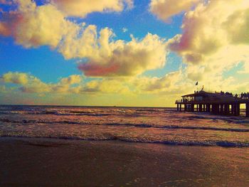 Scenic view of sea against cloudy sky