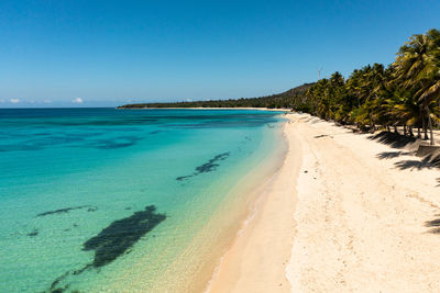 Aerial drone of beautiful beach in the blue water. pagudpud, ilocos norte philippines