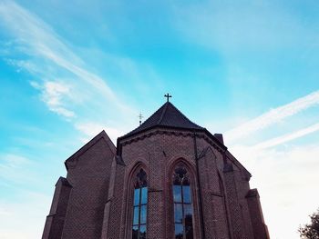 Low angle view of building against blue sky