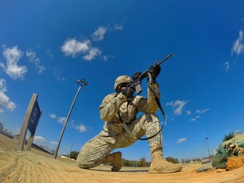 Soldier kneeling and shooting