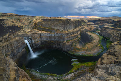 Wide angle long exposure view of palouse falls, washington state with cloudy sky