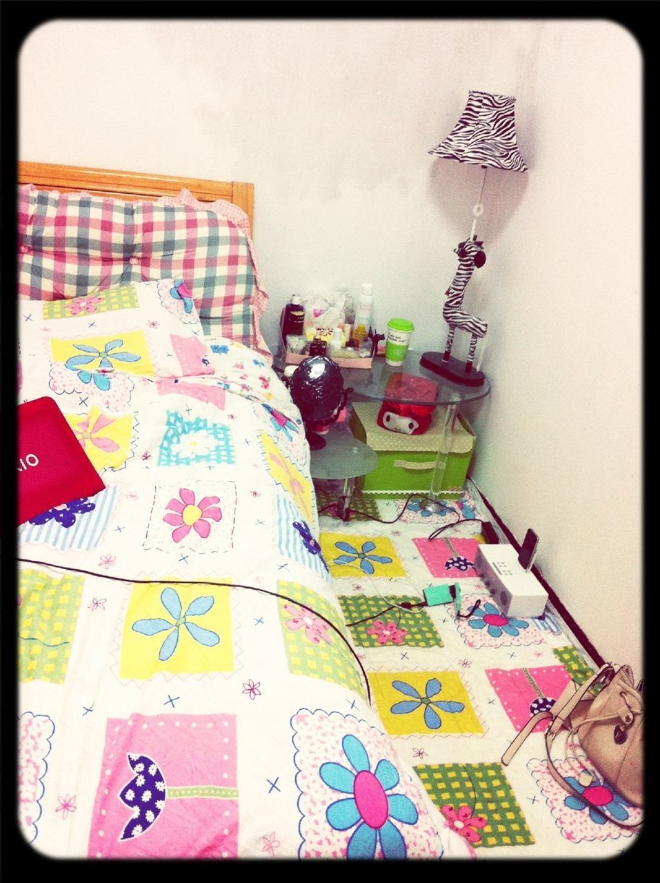 indoors, transfer print, auto post production filter, home interior, high angle view, floral pattern, bed, art and craft, art, creativity, table, pillow, still life, wall - building feature, multi colored, domestic room, no people, animal representation, bedroom, picture frame