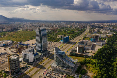 High angle view of buildings in city against sky