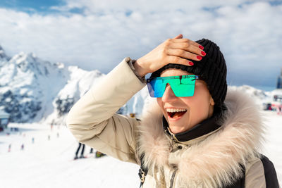 Portrait of smiling woman in snow