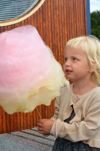 Close-up of girl holding cotton candy