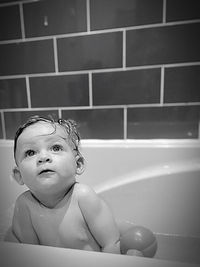 Portrait of cute boy in bathroom