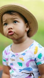 Portrait of young woman wearing hat