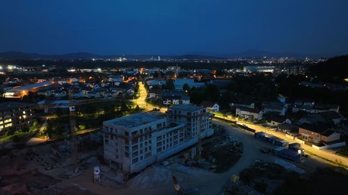 High angle view of illuminated cityscape against sky