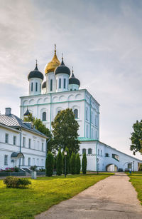 View of church by building against sky