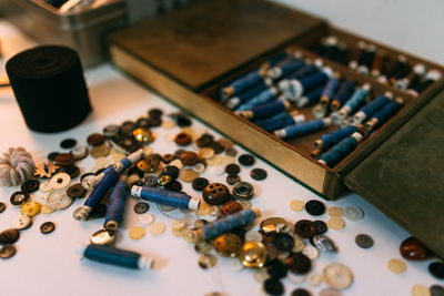 Close-up of buttons and threads on table