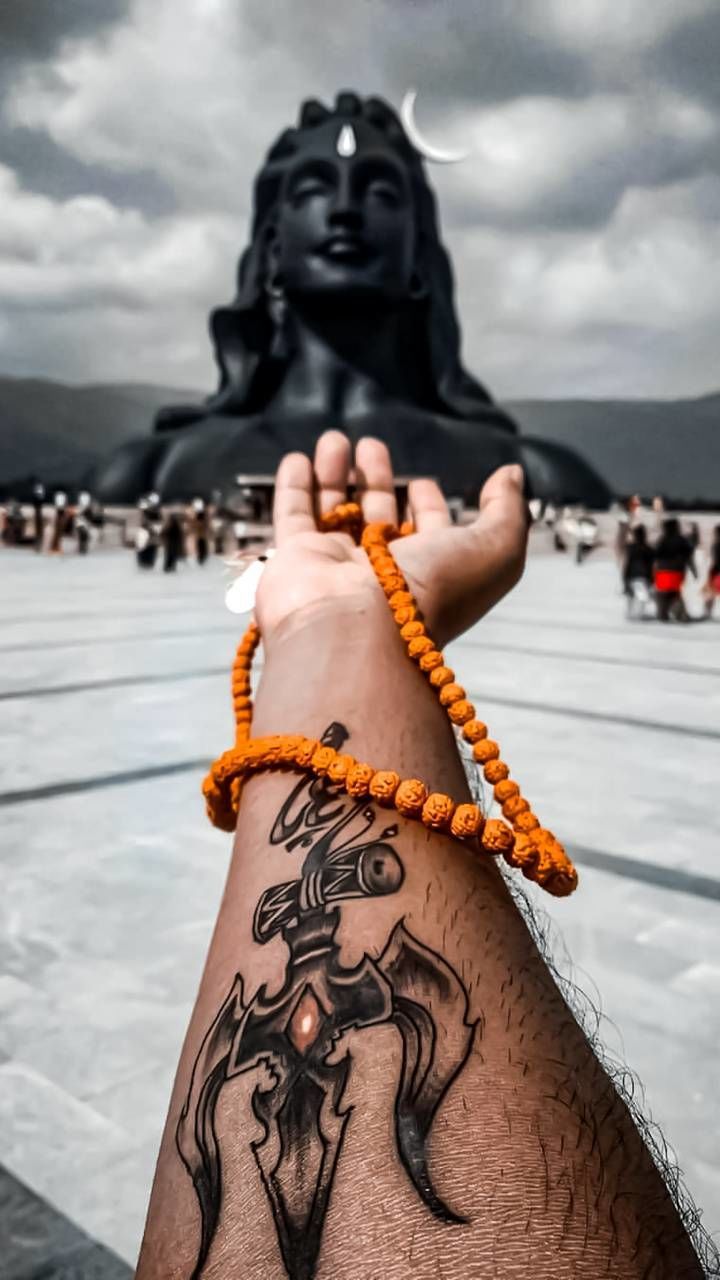 cloud, sky, focus on foreground, adult, spring, religion, one person, statue, temple, nature, belief, representation, sculpture, outdoors, spirituality, black, day, architecture, craft, hand, tradition, travel destinations, creativity