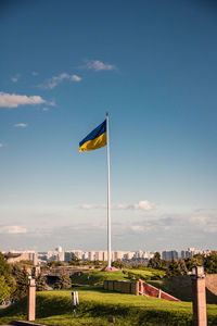 Low angle view of flag against sky