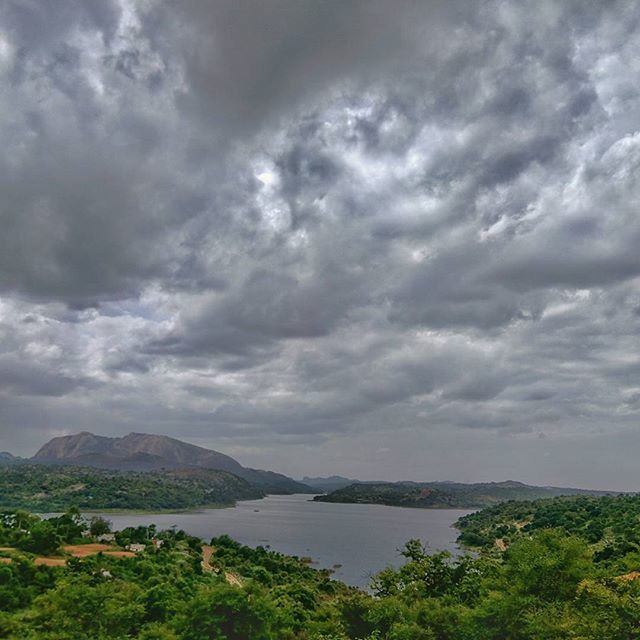 sky, cloud - sky, tranquil scene, scenics, water, tranquility, cloudy, beauty in nature, tree, nature, cloud, mountain, idyllic, lake, sea, overcast, weather, river, landscape, outdoors