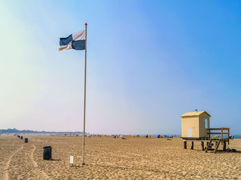 Built structure on beach against sky