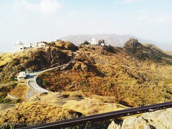 Panoramic view of road and mountains against sky