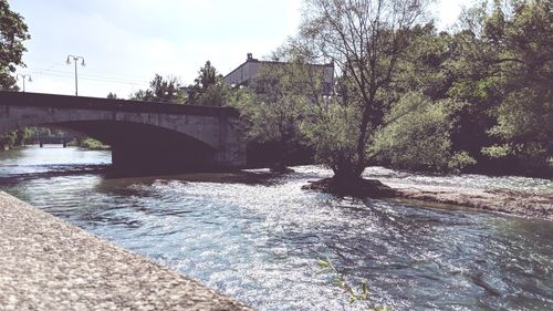 Bridge over river against sky