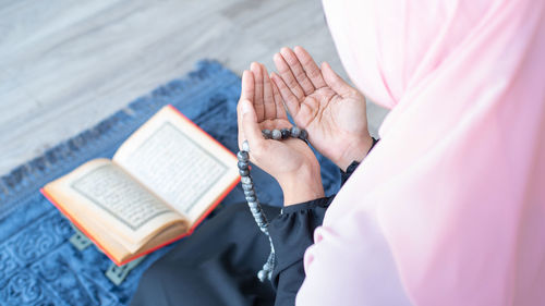 Close-up of man reading book