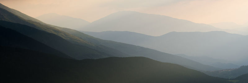 Scenic view of mountains against sky during sunset