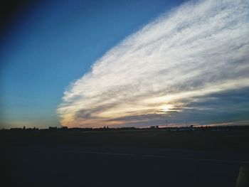 Silhouette landscape against sky during sunset