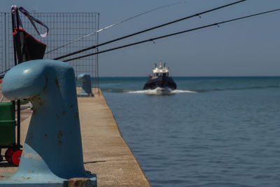 Nautical vessel on sea against clear sky