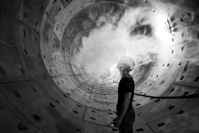 Rear view of woman standing on stage