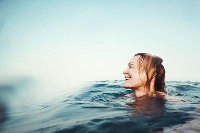 Woman swimming in pool