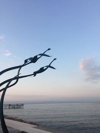 Scenic view of sea against sky at sunset