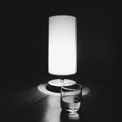 Close-up of candle over black background