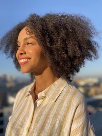 Smiling woman with frizzy hair