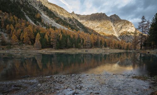 Scenic view of lake and mountains against sky