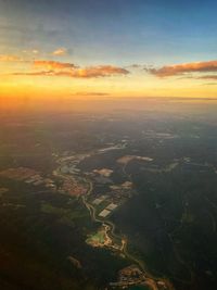 Aerial view of landscape against sky during sunset