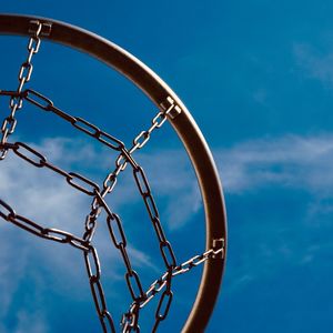 Basketball hoop and blue sky on the street