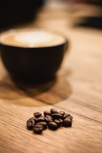 Close-up of coffee beans on table