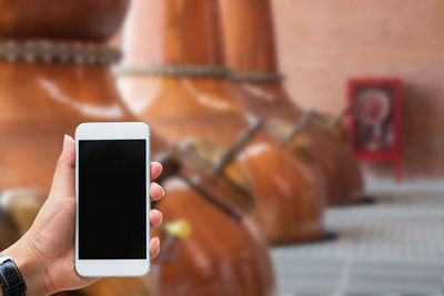 Close-up of hand holding smart phone