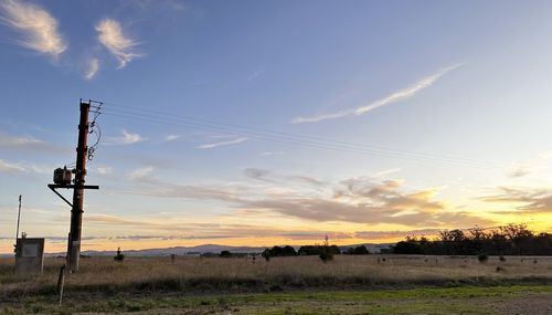 Scenic view of field against sky during sunset