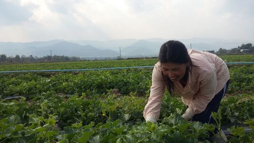 Female farmer working at farm