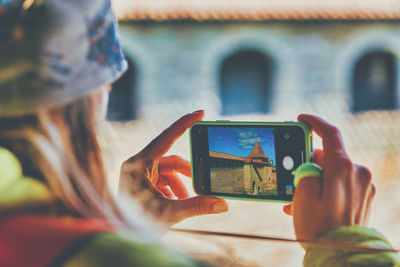 Man photographing with mobile phone