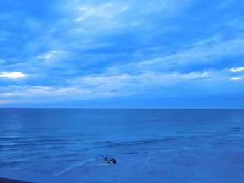 Scenic view of sea against blue sky