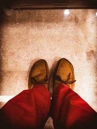 Low section of man standing on floor