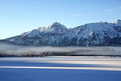 Scenic view of snowcapped mountains against sky