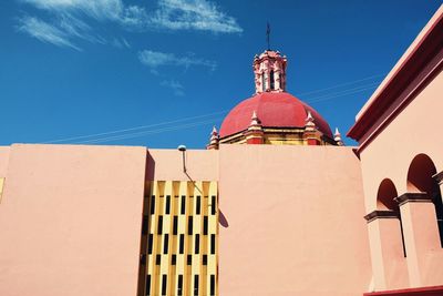 Low angle view of building against blue sky