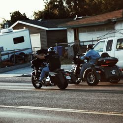 Man riding motorcycle on road