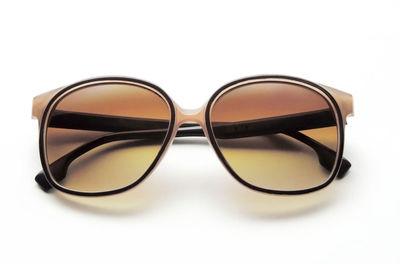 Close-up of sunglasses against white background