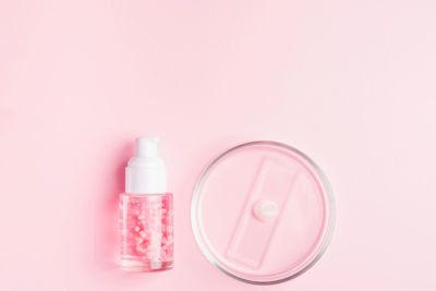 Close-up of beauty products against white background