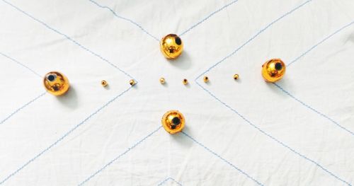 Close-up of golden beads