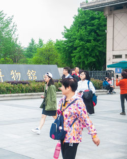 People walking on street in city