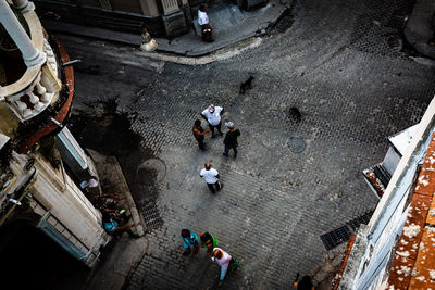 High angle view of people standing on street